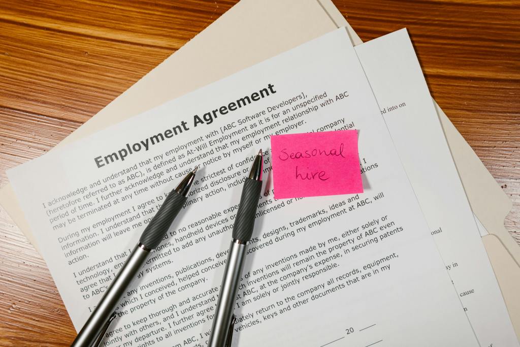 Professionals reviewing a Dutch employment contract before signing