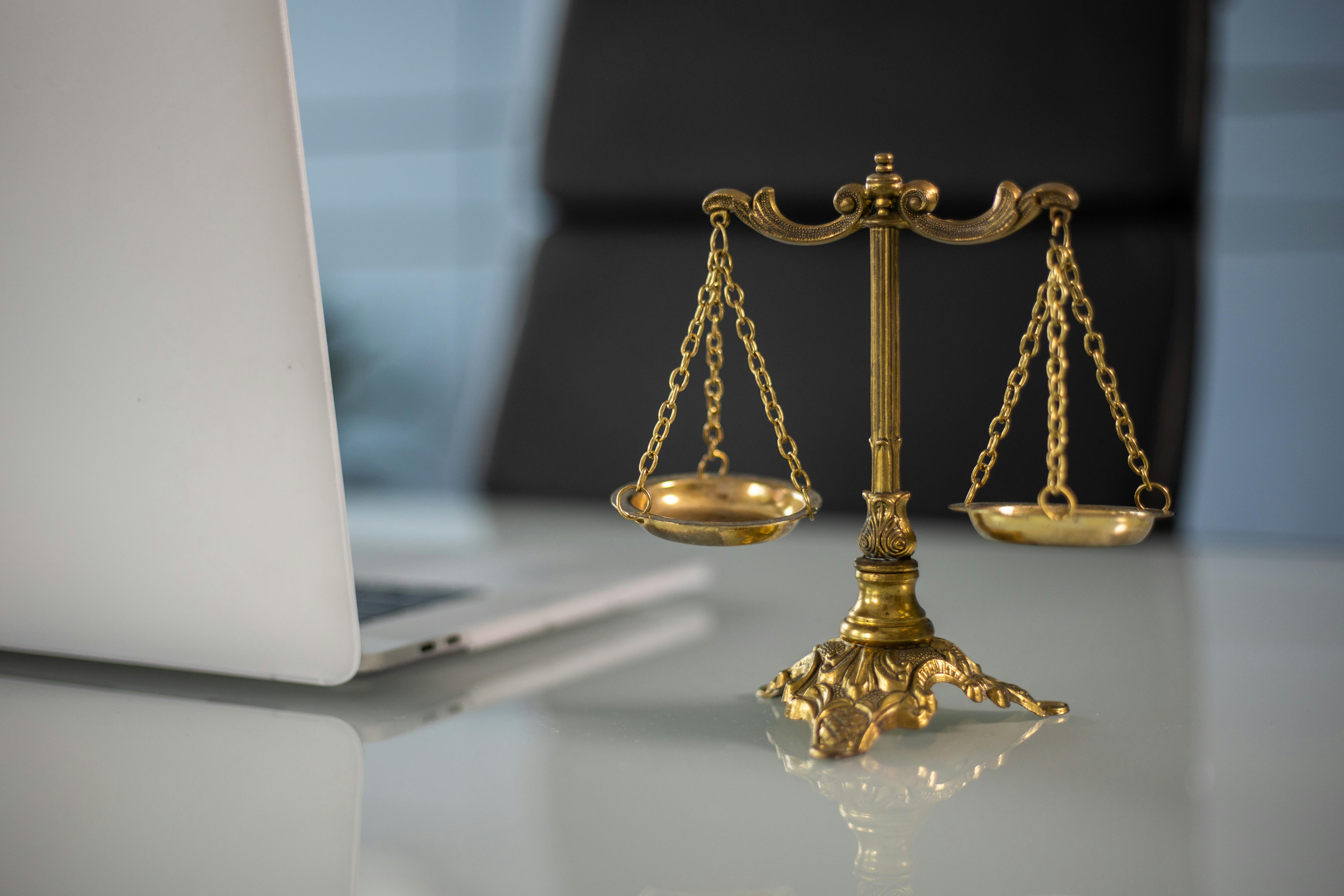Wrongful termination lawyer Netherlands reviewing dismissal case at Dutch courthouse