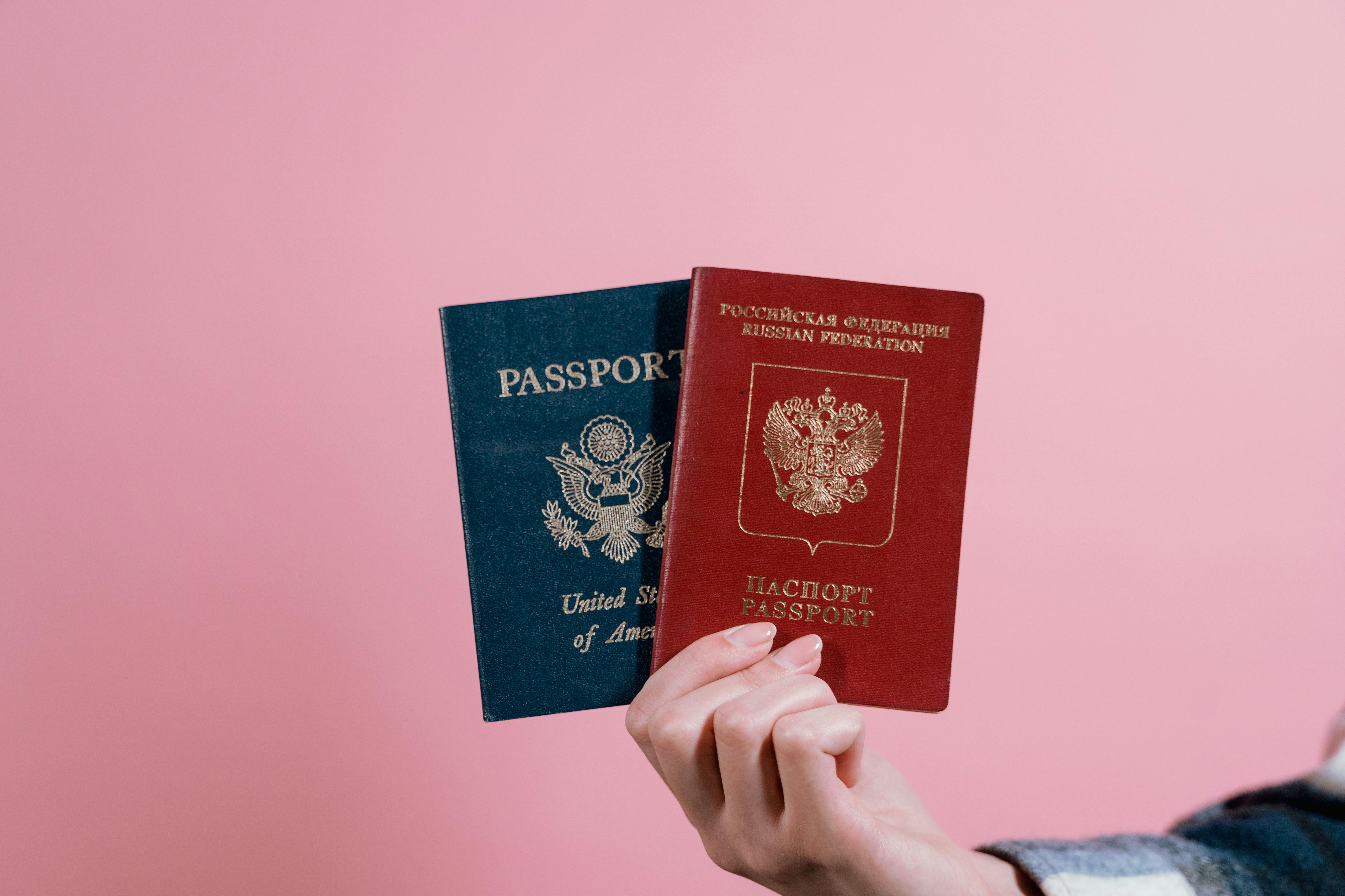 Traveler holding passport at airport checkpoint